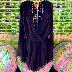 Girl Revolution short black romper with lace trim